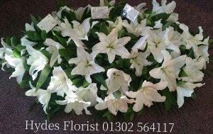lillies-coffin-top-hydes-florist-doncaster-funeral-flowers  